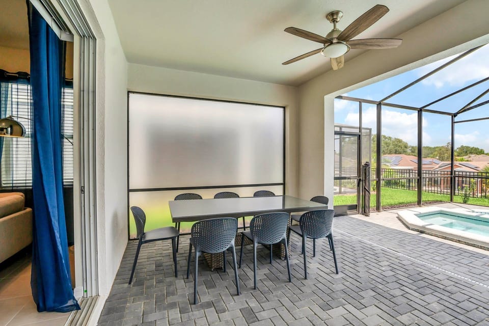 Outdoor patio dining area with a large table seating up to 8—ideal for family meals, gatherings, or enjoying a sunset dinner in a relaxed, open-air setting.