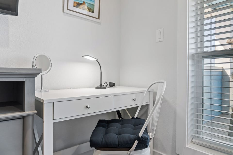 Desk in the king bedroom can be used as a vanity or for remote work or school.
