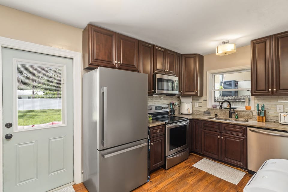 Fully stocked kitchen located in the back of the house behind the living room.