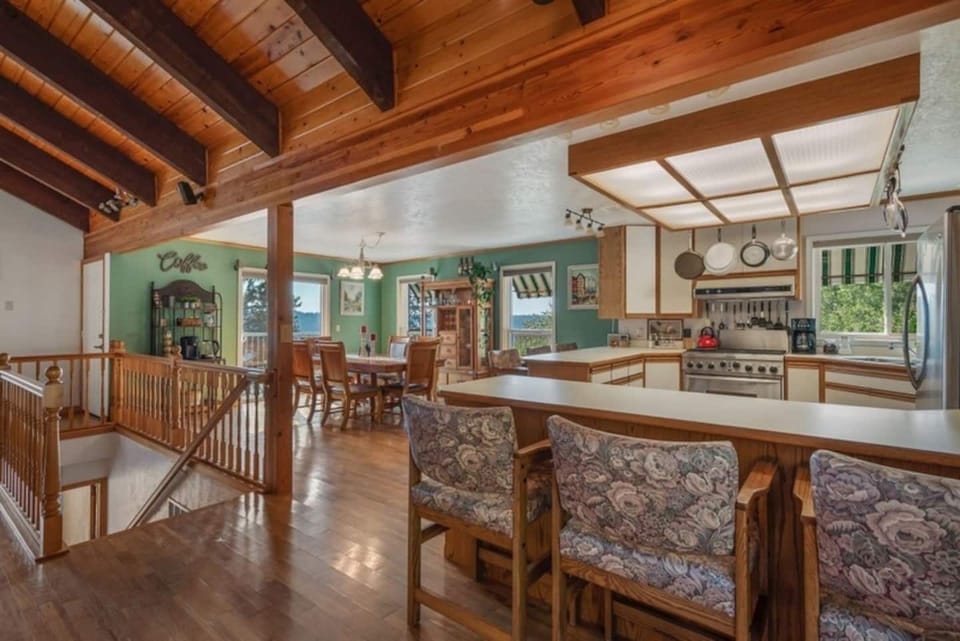 KITCHEN and DINING ROOM with STAIRS TO FAMILY ROOM AND 3 BEDROOMS