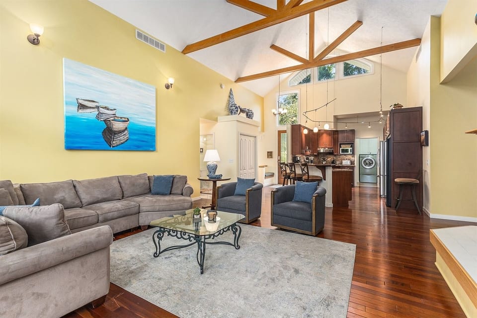 Open floor plan with soaring ceilings letting the light shine in