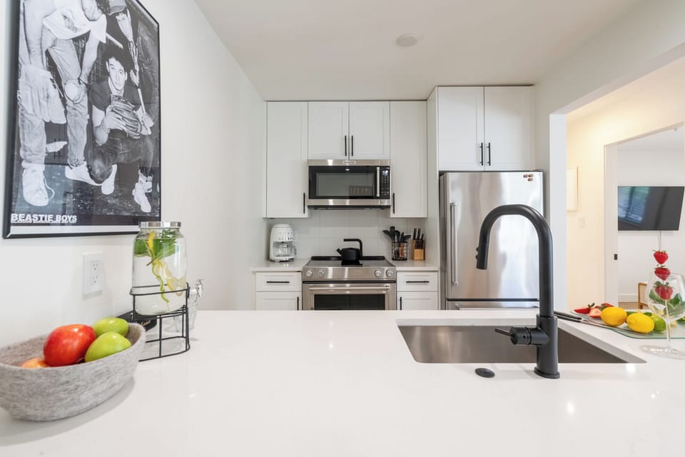 Freshly re-designed, the kitchen is open & airy. 