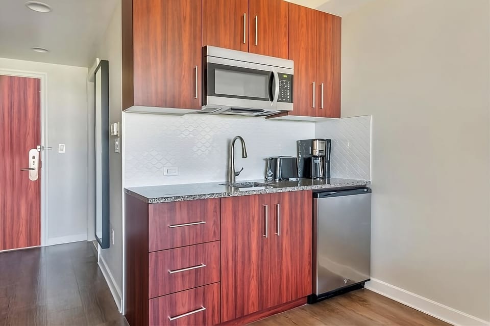 Brew morning coffee easily in your sleek in-room kitchenette.