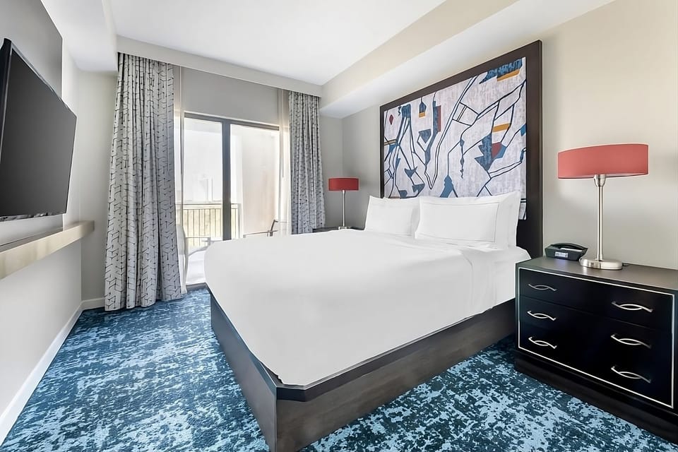 Stretch out on crisp linens and enjoy the airy layout.