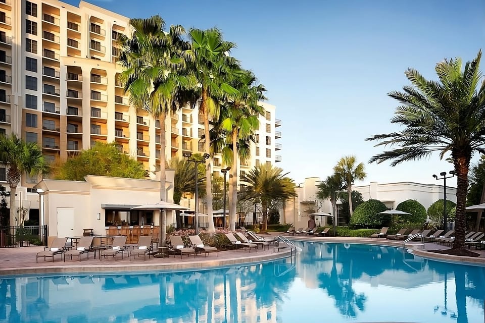 Unwind at dusk with a serene swim and poolside cocktails.