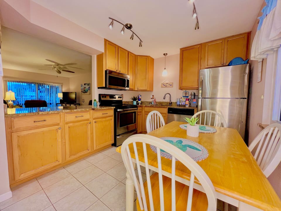 Large kitchen with full size refrigerator, stove/oven, microwave, dishwasher.