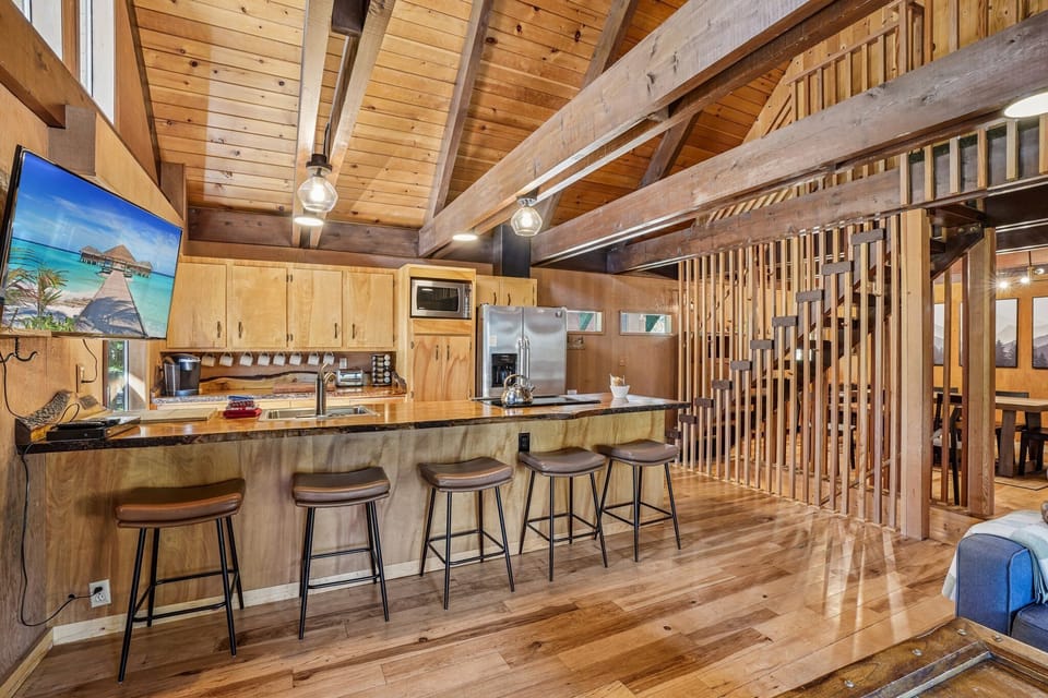 Large kitchen fully equipped plus bar seating for 5