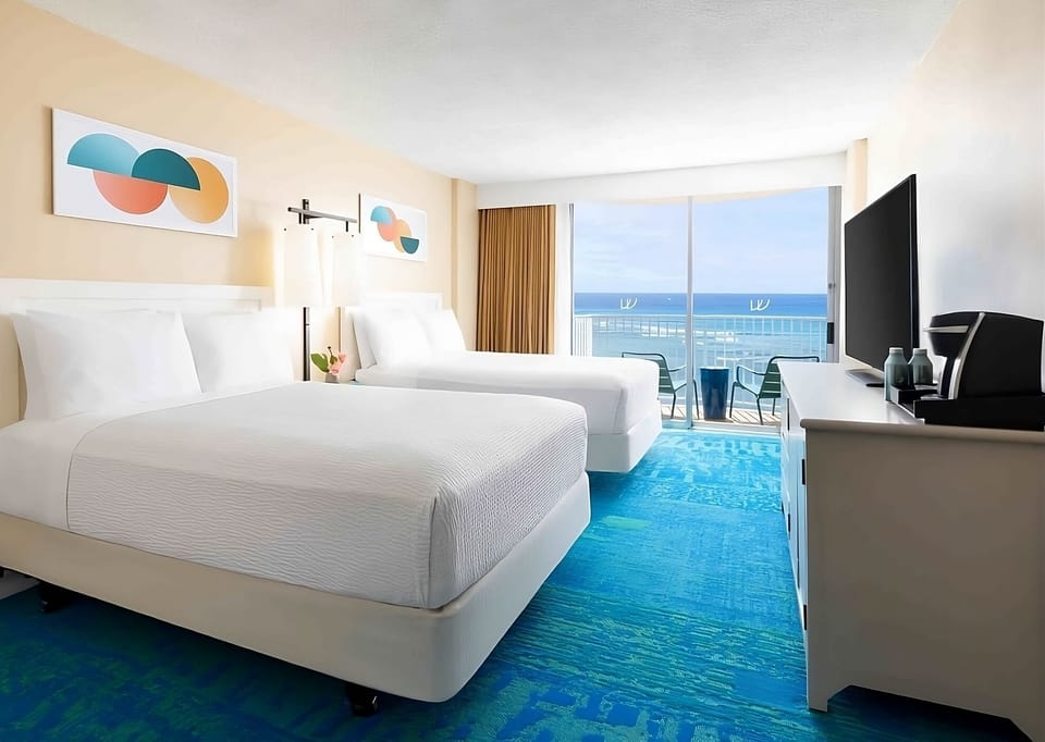Wake up to ocean views from your airy double-queen room.