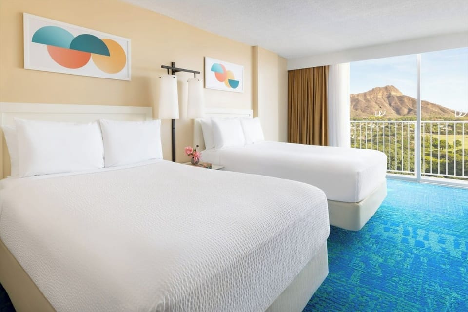 Wake up to sunlit beds and sweeping mountain views.