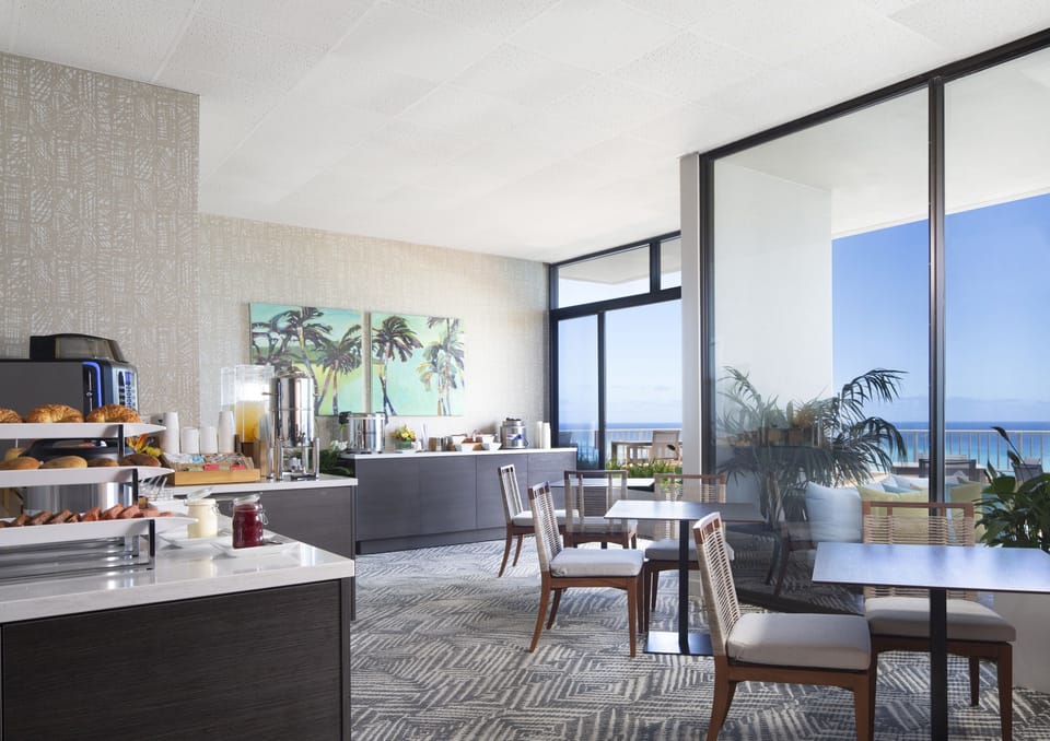 Start mornings with fresh breakfast spreads in sunlit seating.