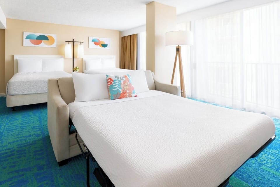 Gather everyone comfortably with two beds and extra lounging.