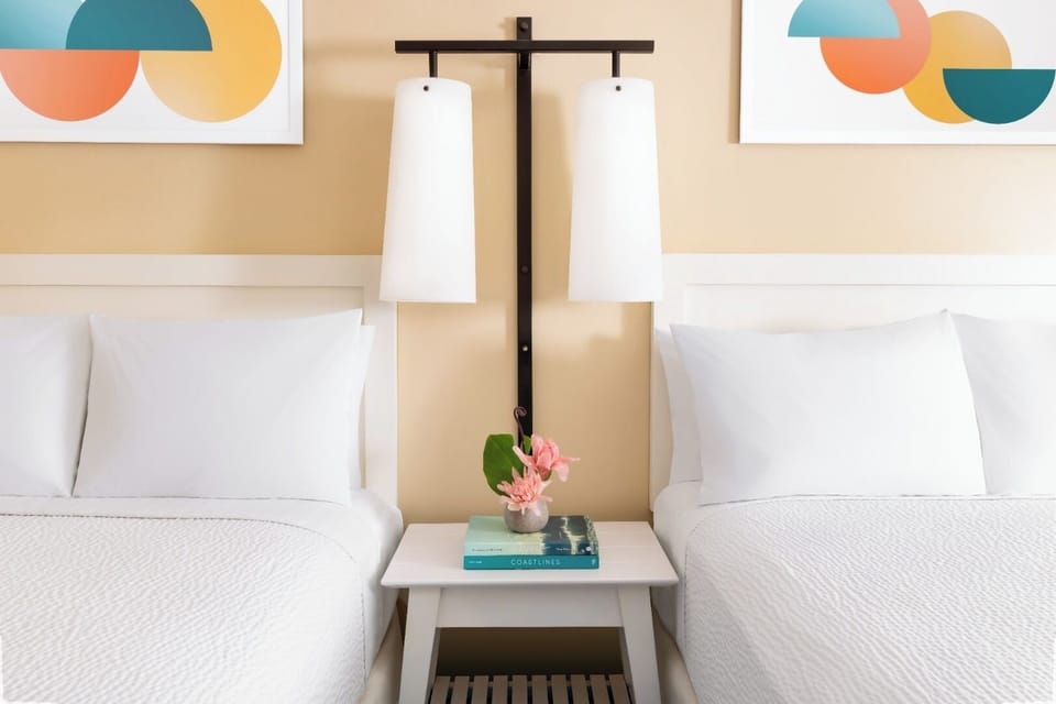 Settle in with cozy bedside lighting and calming modern art.