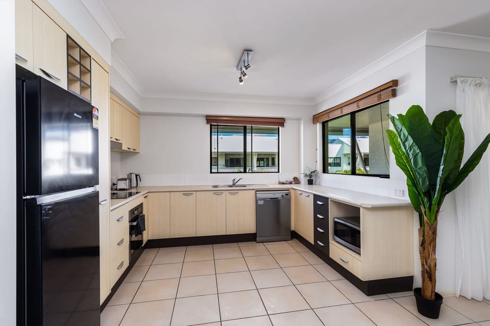 Full kitchen with fridge, dishwasher, microwave, toaster and oven.