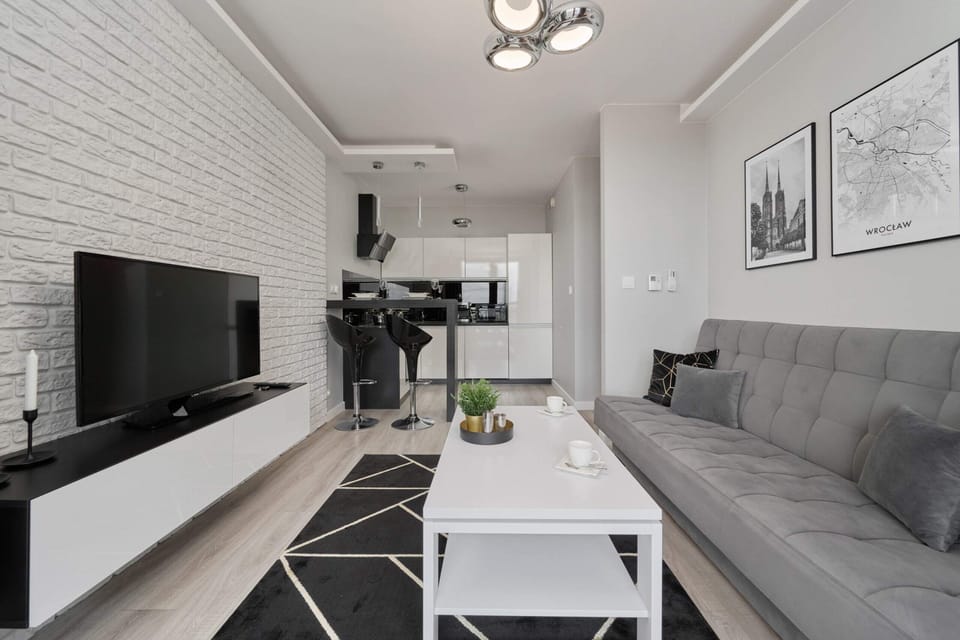 Living room with a comfortable sofa and TV. 