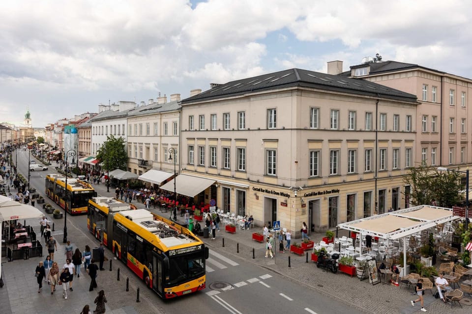 A view of the charming neighborhood with classic architecture, showcasing the location of the apartment.