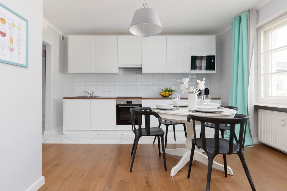 A beautifully set dining table in the open kitchen area, perfect for enjoying meals with family or friends.