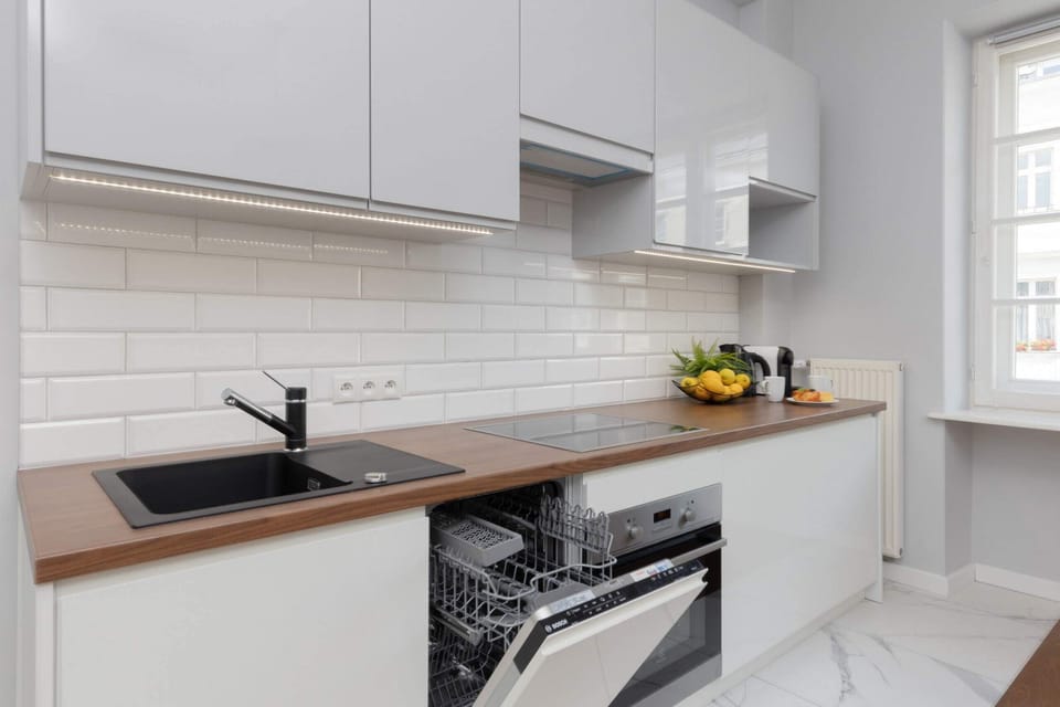 Kitchenette with oven and refrigerator. 
