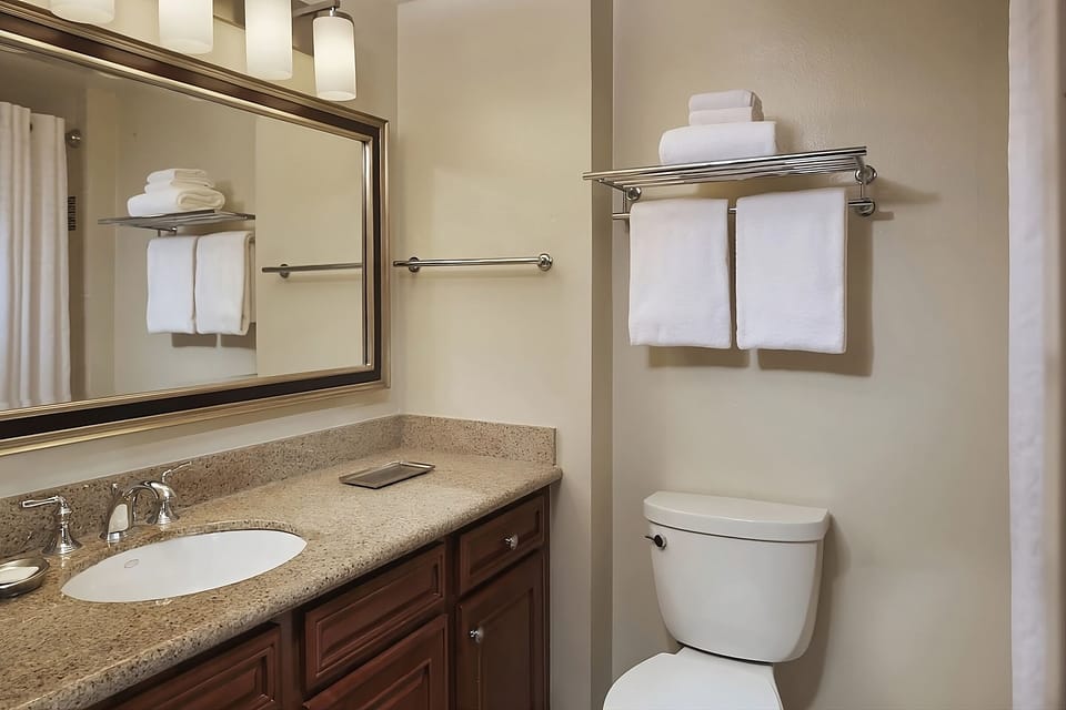 Refresh easily with bright vanity space and plush towels ready.