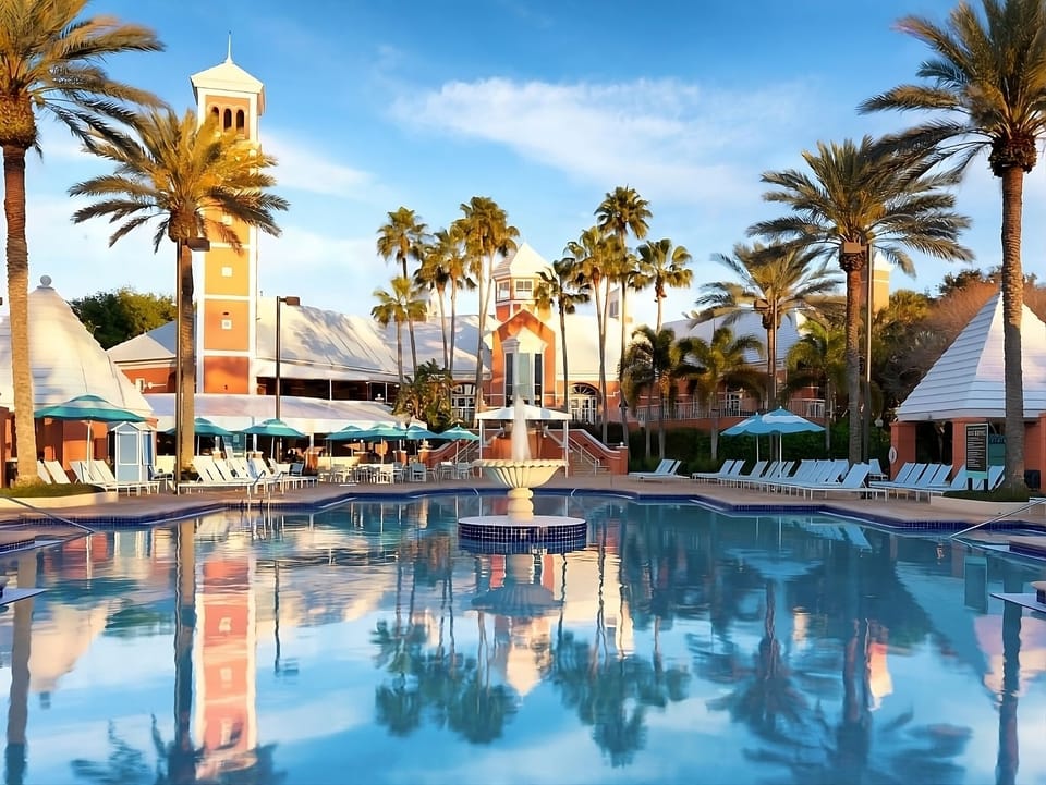 Unwind at sunset with palm reflections and serene pool vibes.