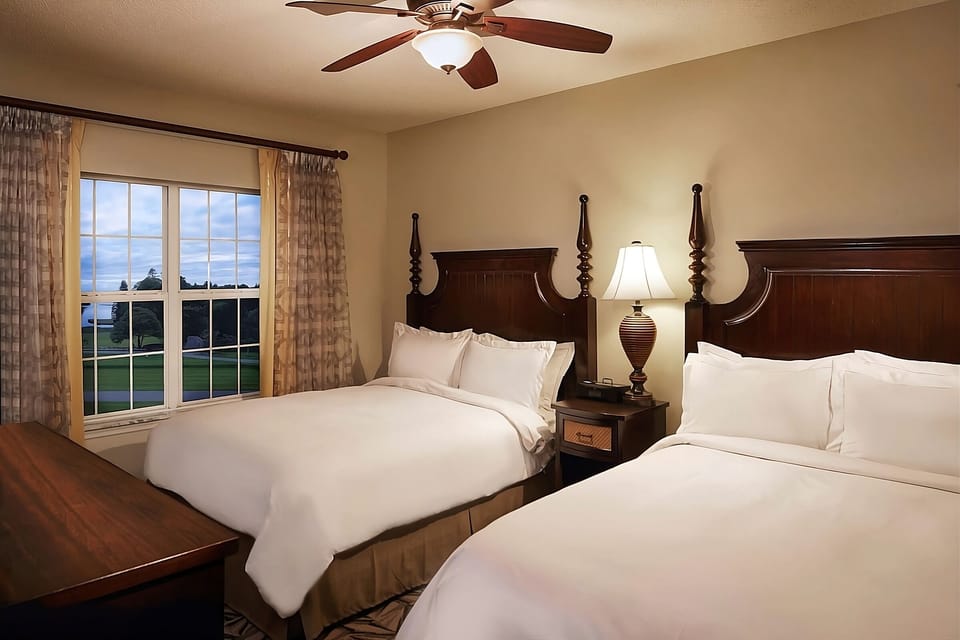 Drift off with peaceful window views and hotel-crisp comfort.