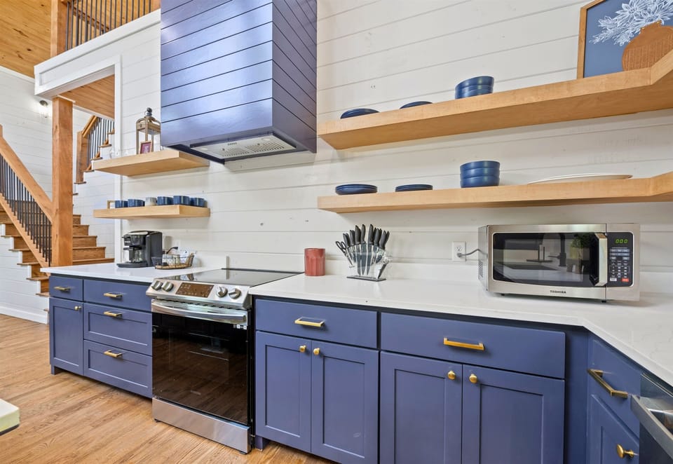 This well-equipped kitchen present an inviting layout and ample storage