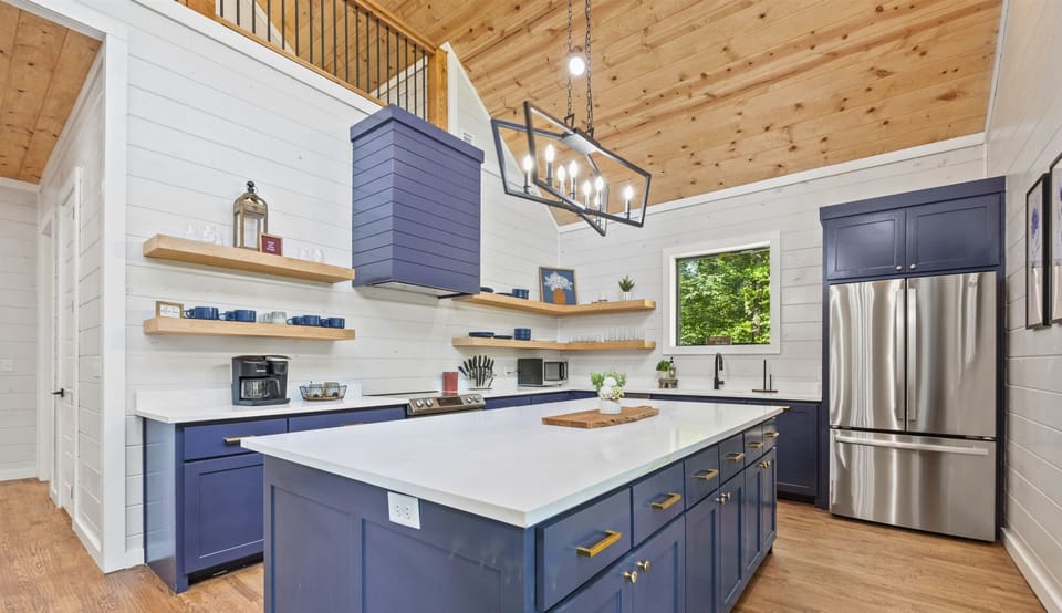 Enjoy cooking in this charming kitchen, featuring modern appliances and plenty of counter space.