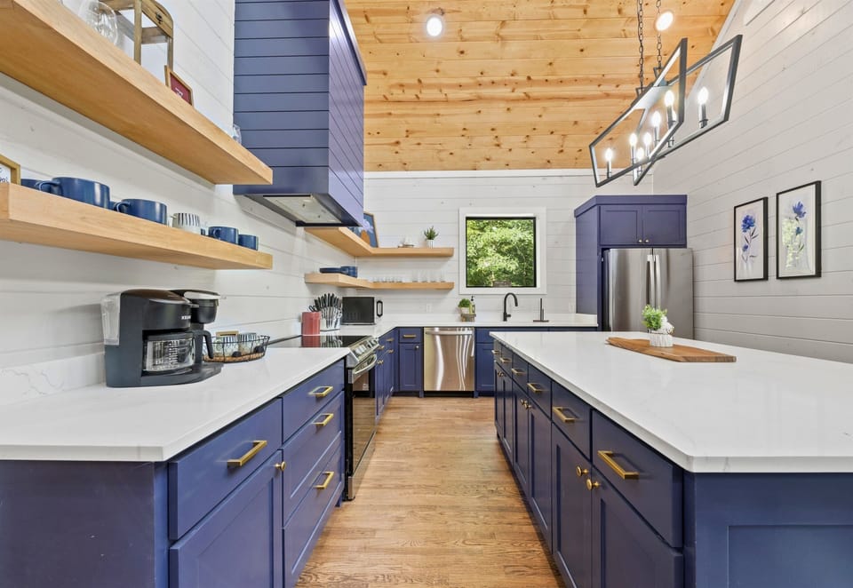 This kitchen has all you need for a fantastic cooking experience, featuring modern appliances and ample counter space.