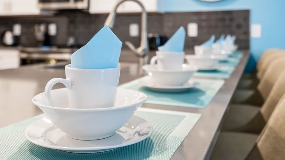 Elegant place settings with a pop of blue, perfect for morning coffee or evening chats!
