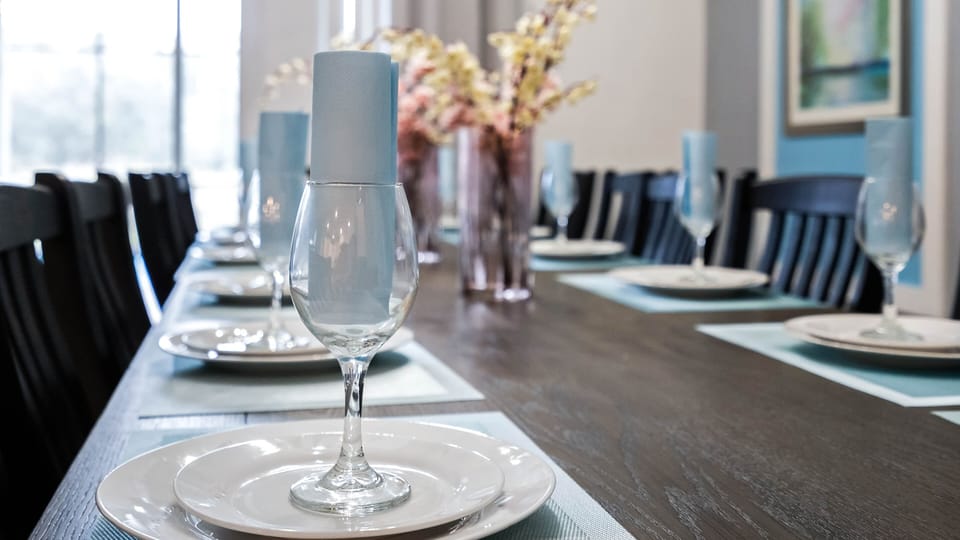 Elegantly set dining table with chic tableware, perfect for hosting memorable meals.