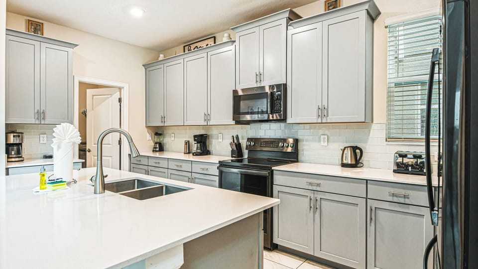 Unleash your inner chef in our modern kitchen, complete with top-of-the-line appliances for your convenience.