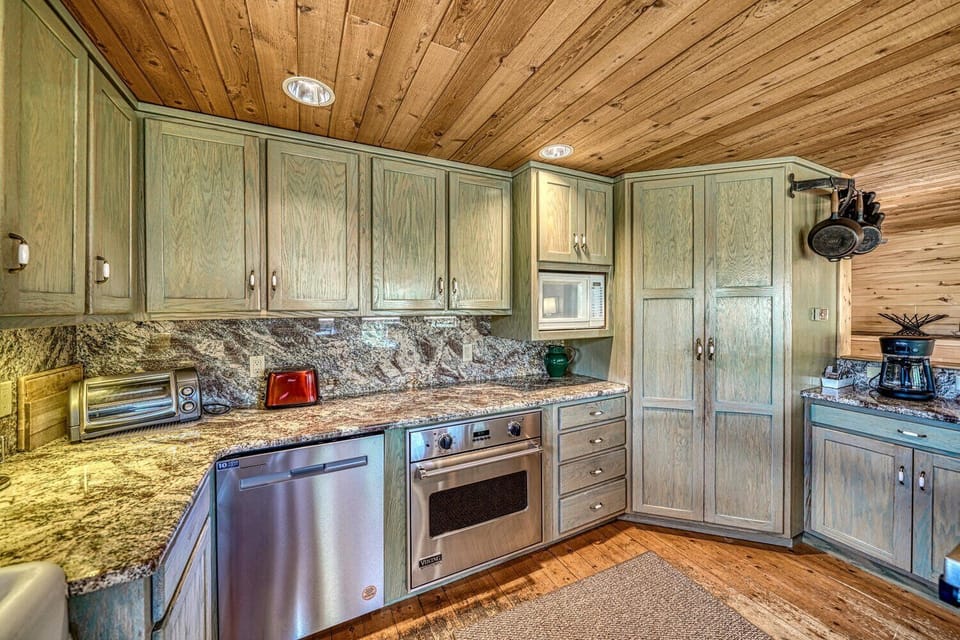 Fully-appointed kitchen with bar seating, dishwasher, pantry, and coffee maker.