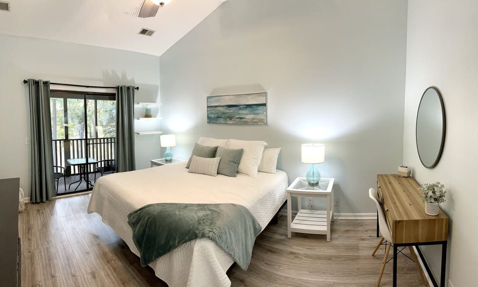 Off the living area is a large bedroom with a king bed and new king mattress.