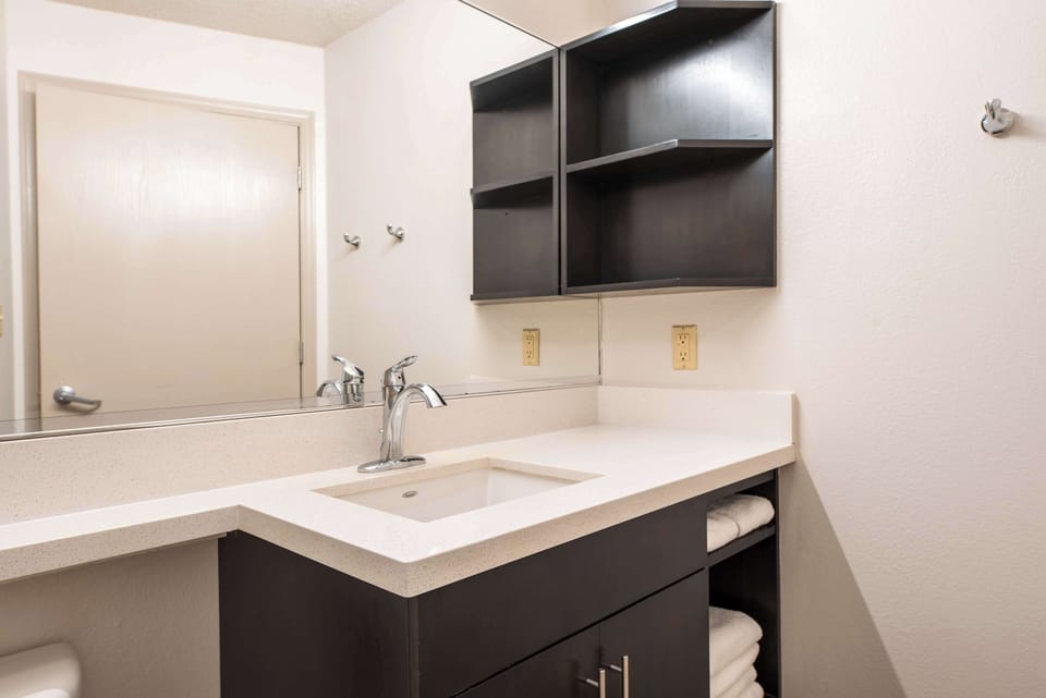 Refresh easily at the spacious vanity with bright mirror lighting.