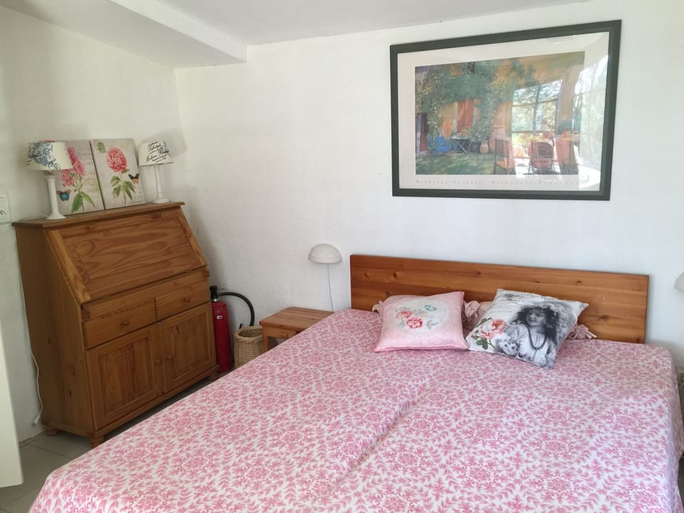 Parents bedroom with doors to terrace and gardens
