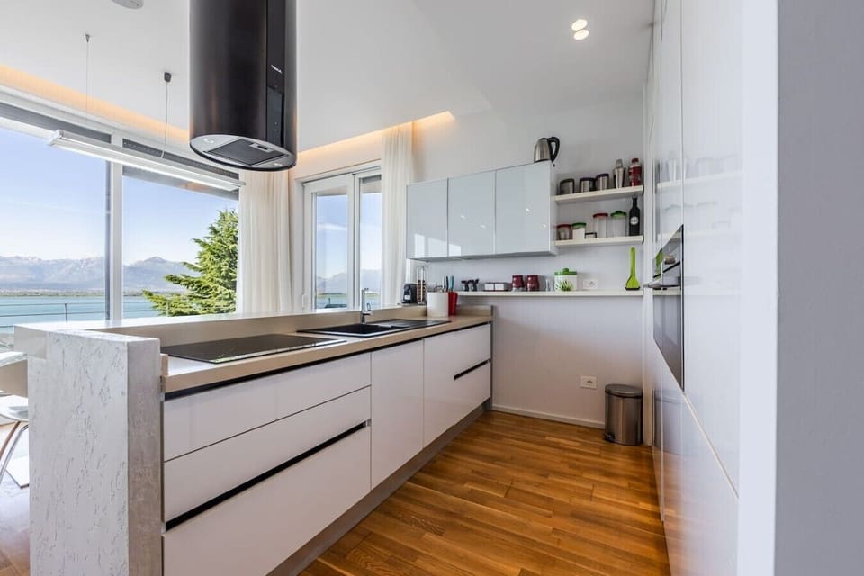 Kitchen with marble countertops and panoramic Lake Shkodër views in this Albania villa rental.