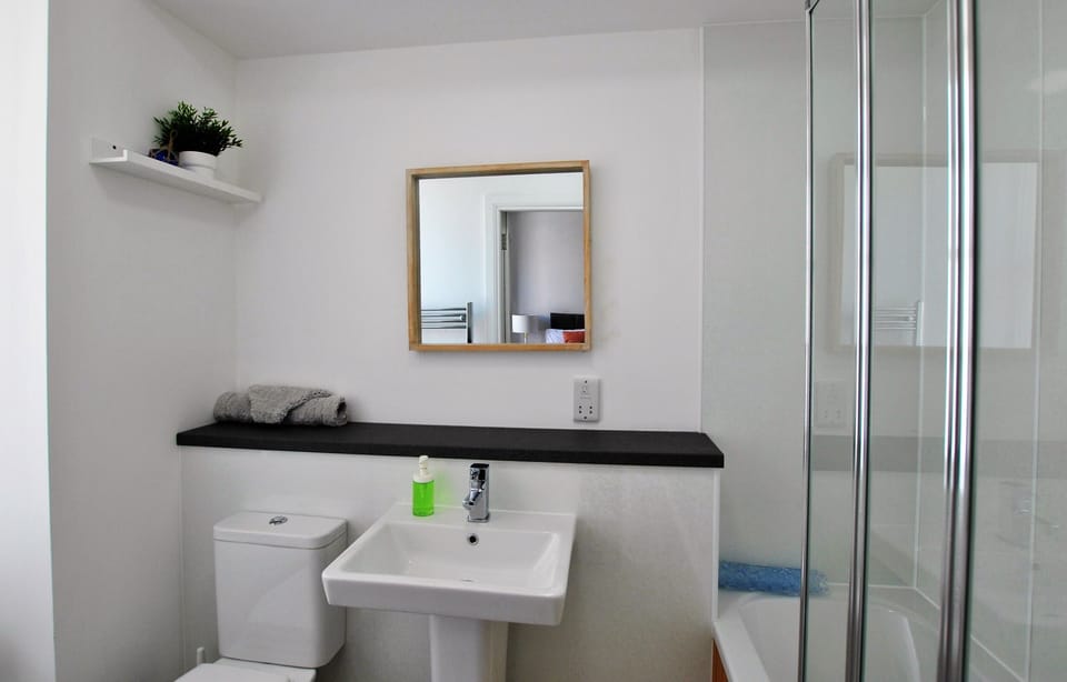 The en-suite room has a shower over the bath