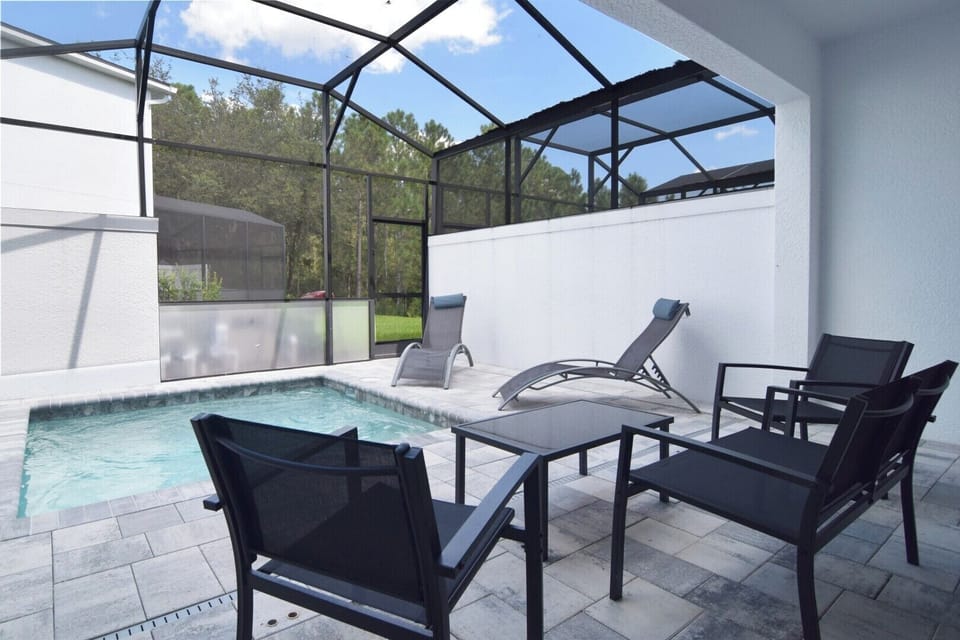 Private dip pool with loungers and shaded seating area