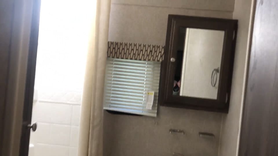 Mirror cabinet for plenty of space for personal toiletries. 