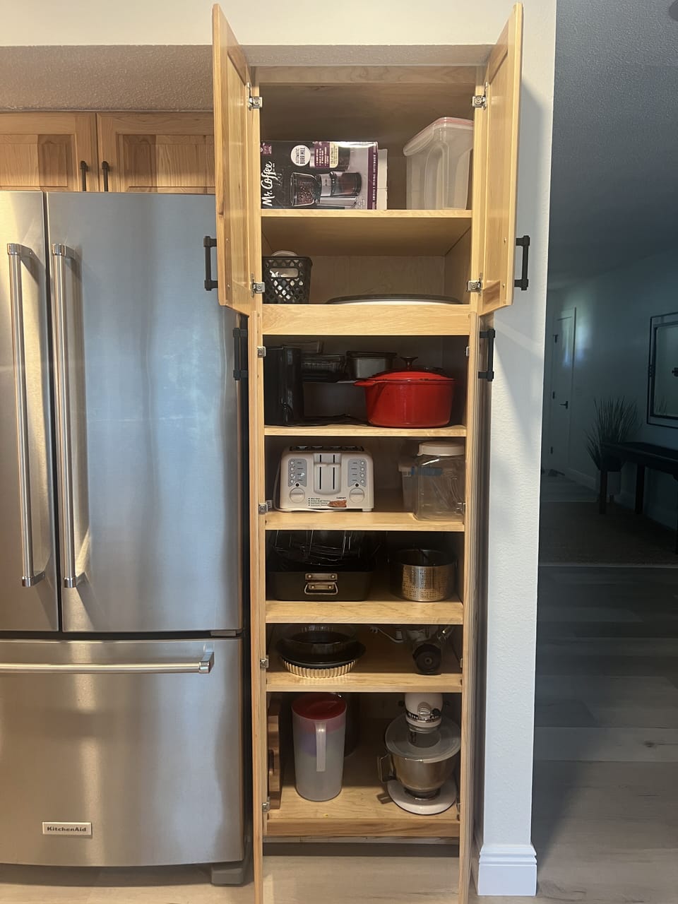 Pantry cabinet with baking pans, Dutch oven and more