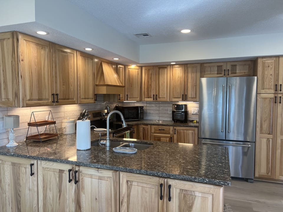 Kitchen offers granite counters and stainless appliances, tons of cooking tools