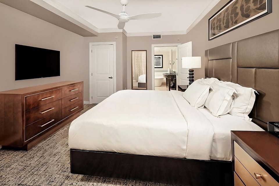 Sink into plush pillows in this calm, modern retreat.