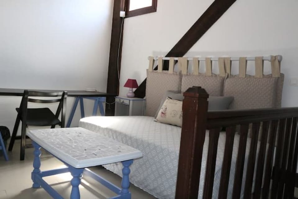 Mezzanine with single size bed , sofa and working station . 
