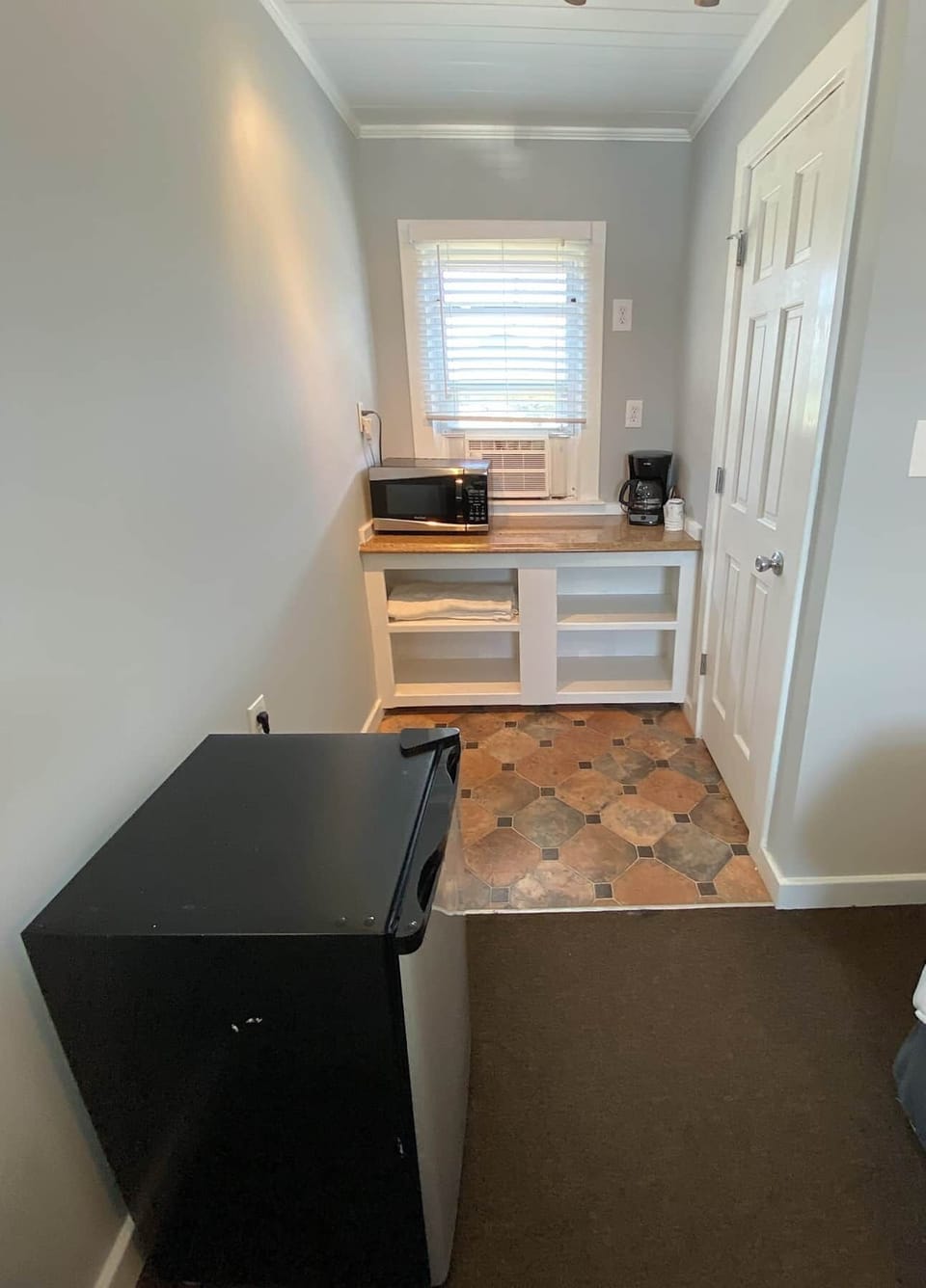 Appliances including mini-fridge, microwave and coffee maker