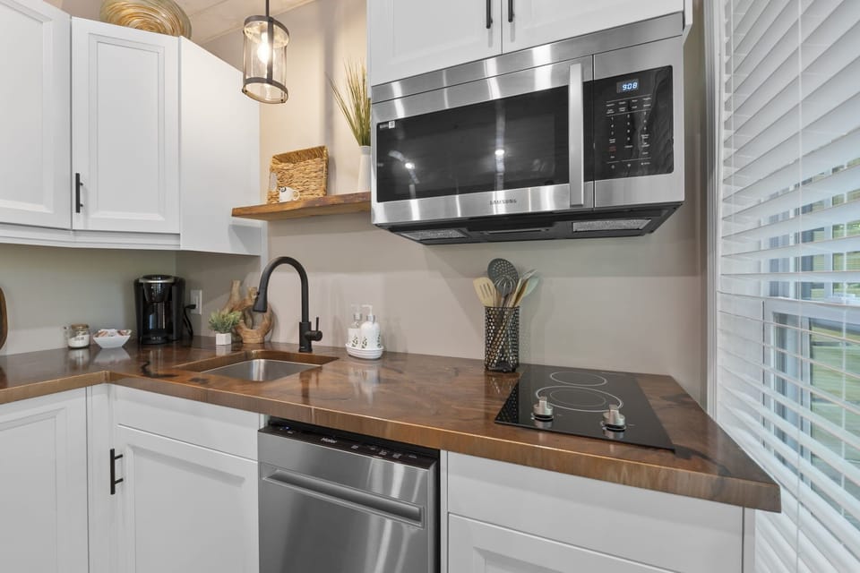 Microwave, dishwasher & Keurig coffee maker. We provide coffee, creamer & sugar.