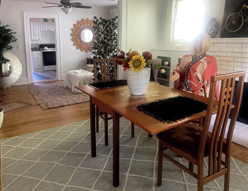 front room/living room,  I use for dining area, table is vintage teak folds up