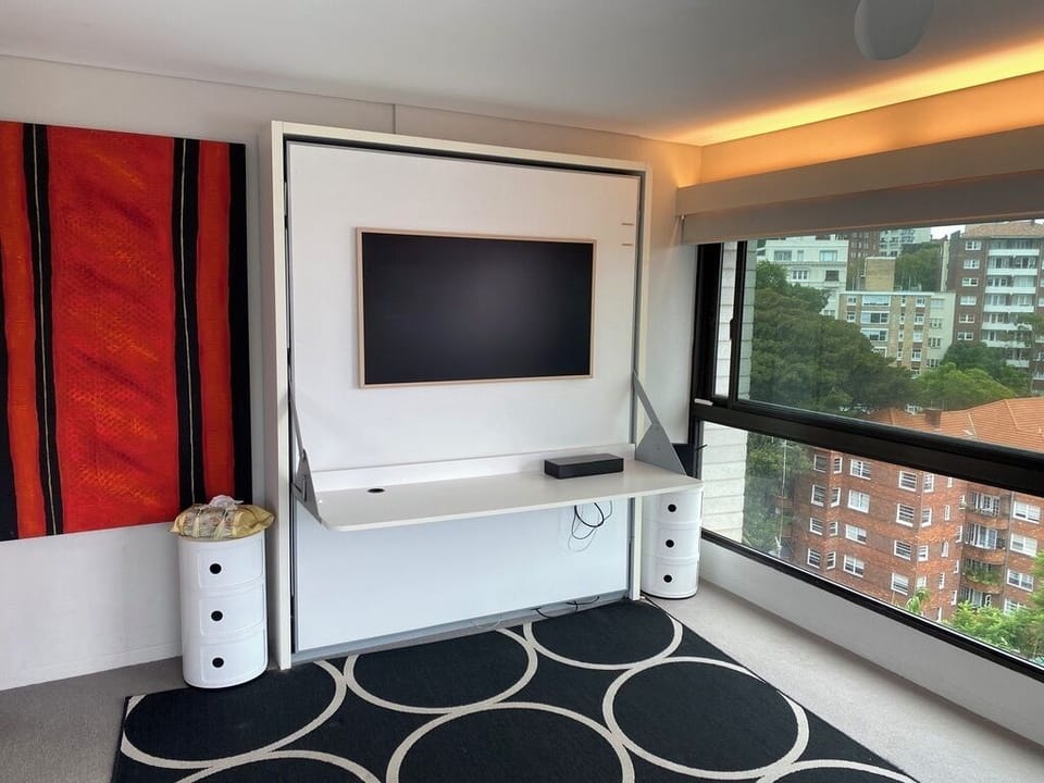 Wall bed - closed + TV + desk
Kartell bedside cabinets
