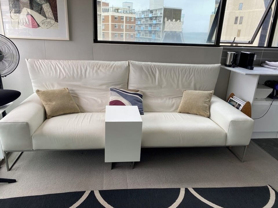 White leather sofa with marble coffee tables x 2