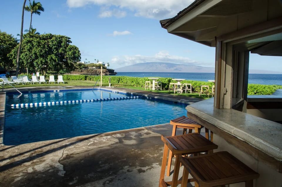 Sip sunset drinks poolside with sparkling water just steps away.