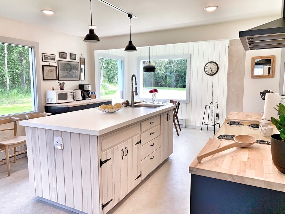 More windows in the kitchen, a wonderful gathering space to prepare meals.
