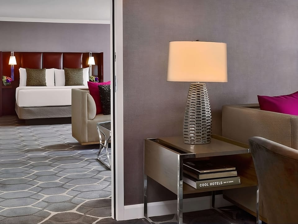 Sip morning coffee in a stylish sitting nook with warm lamp glow.
